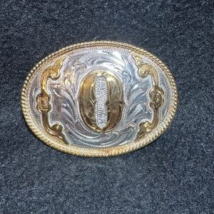 Silver and Gold Oval Belt Buckle with the initial “O”